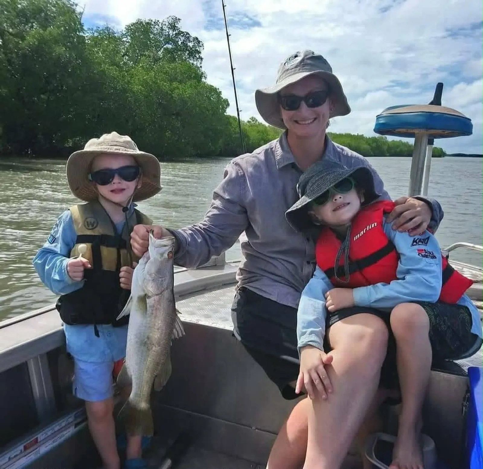 A family fishing and cruising the mangroves together